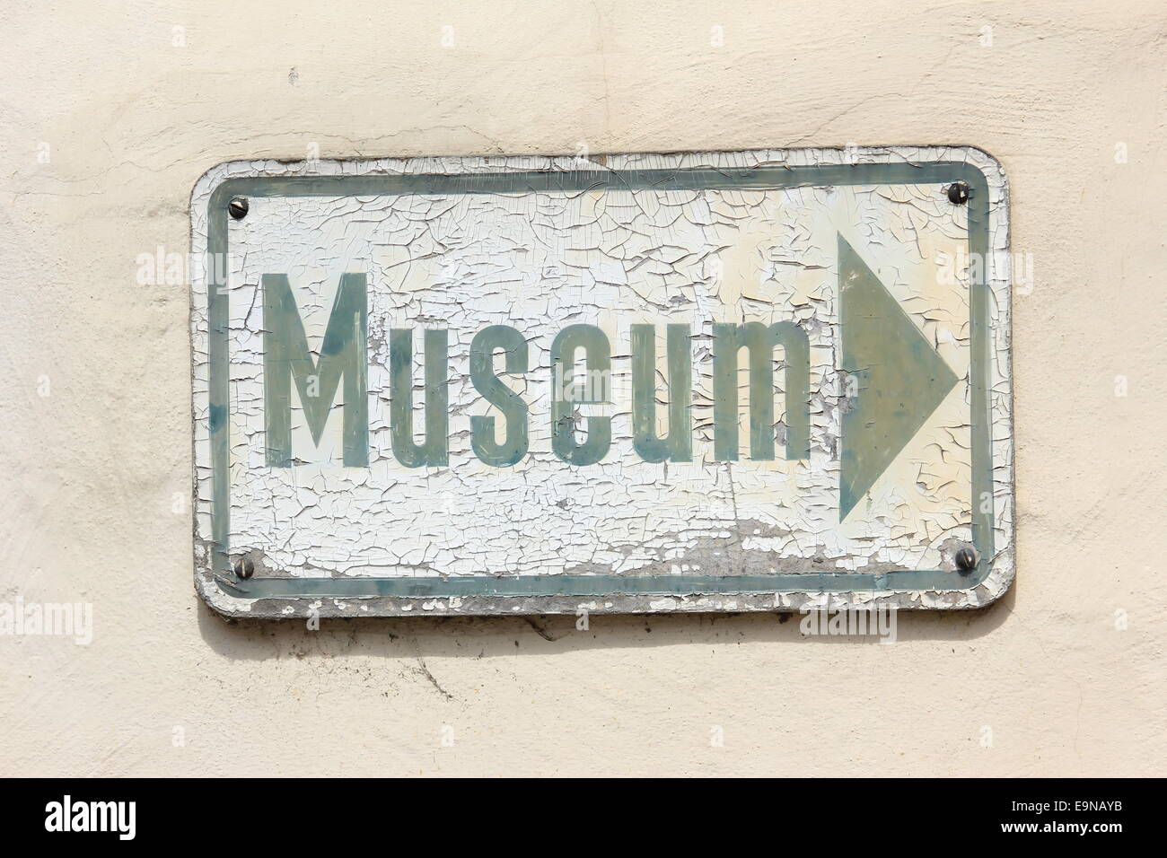 Weathered sign to a museum Stock Photo