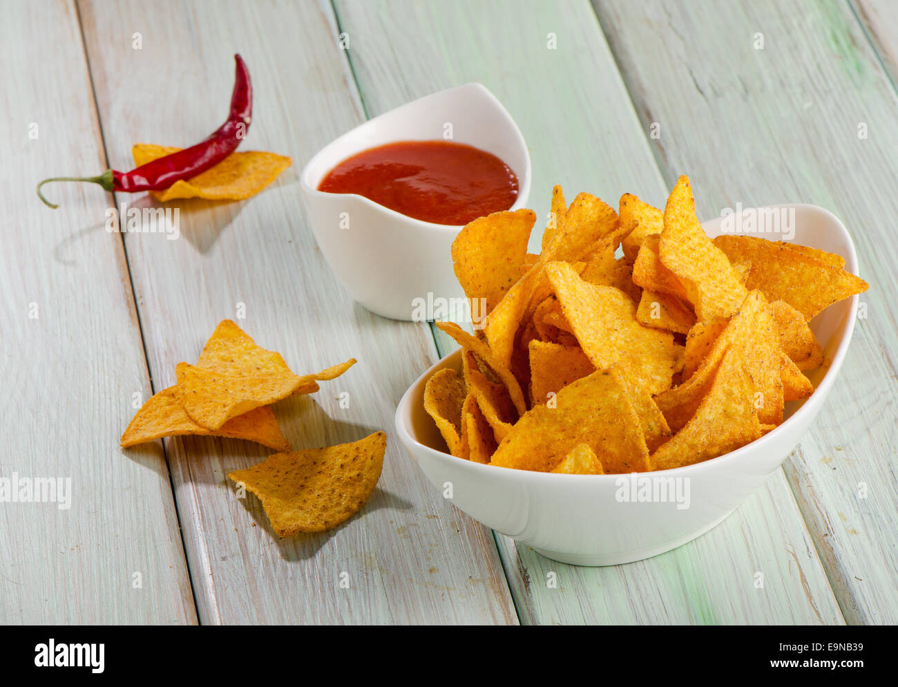 Corn chips  with sauce on wooden table. Selective focus Stock Photo