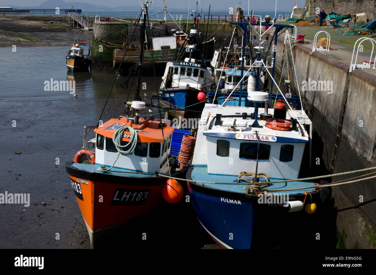 Fishing boats in Port Seton Harbour, near Edinburgh, Scotland, with the