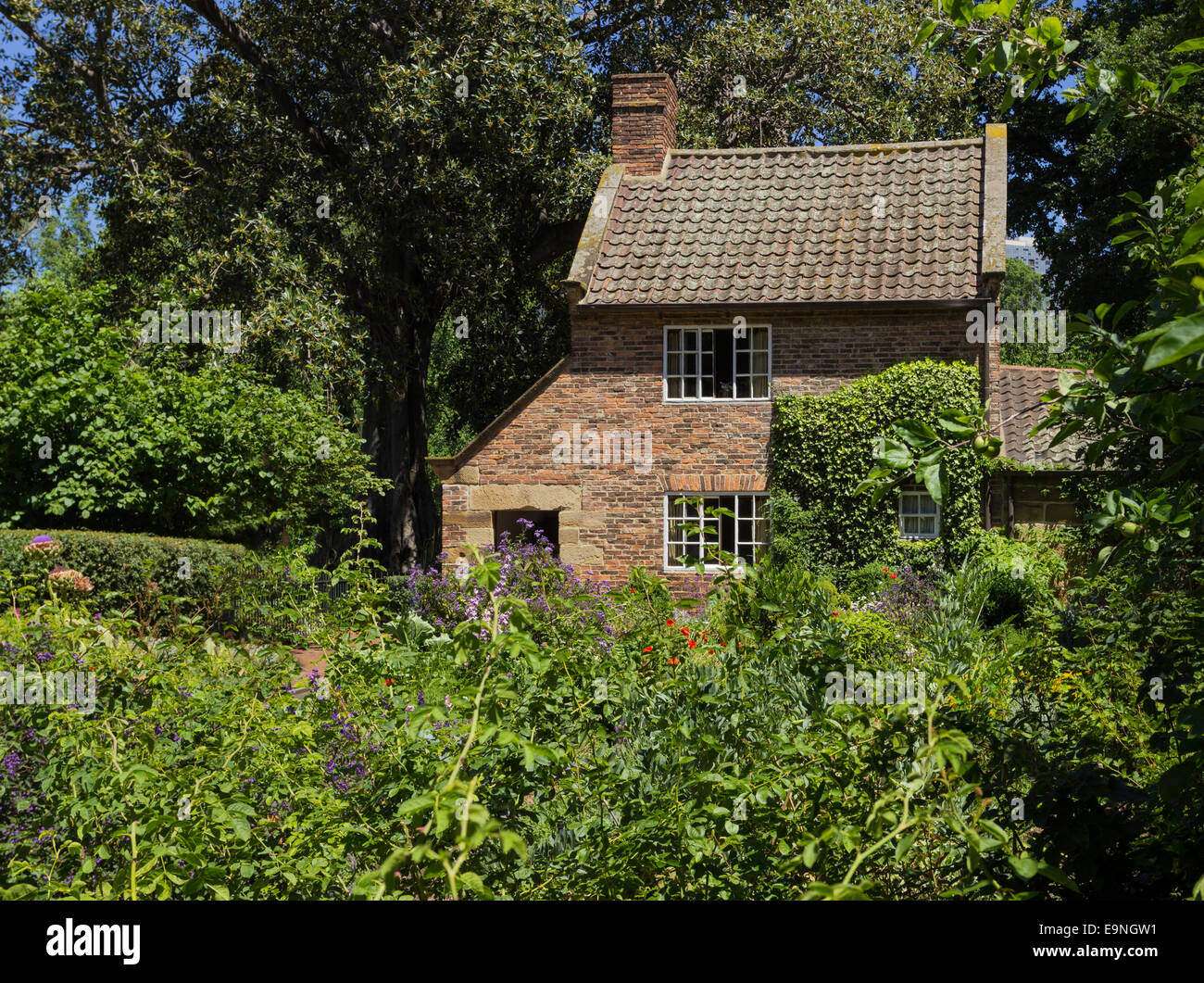Cottage garden of small brick home Stock Photo