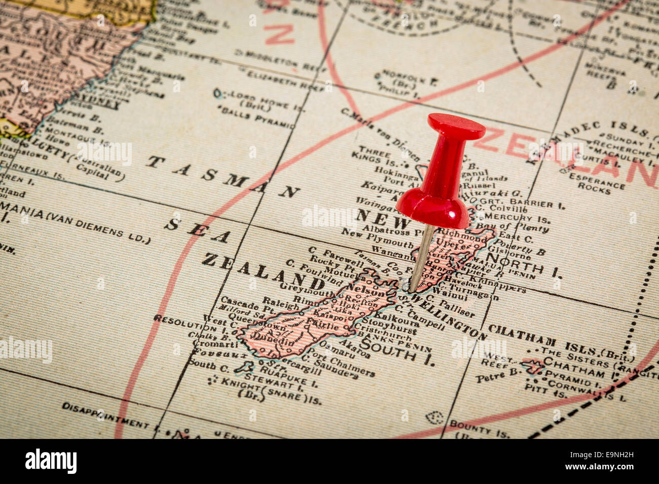New Zealand and Tasman Sea with a pushpin on Wellington on a vintage 1920s map, selective focus Stock Photo
