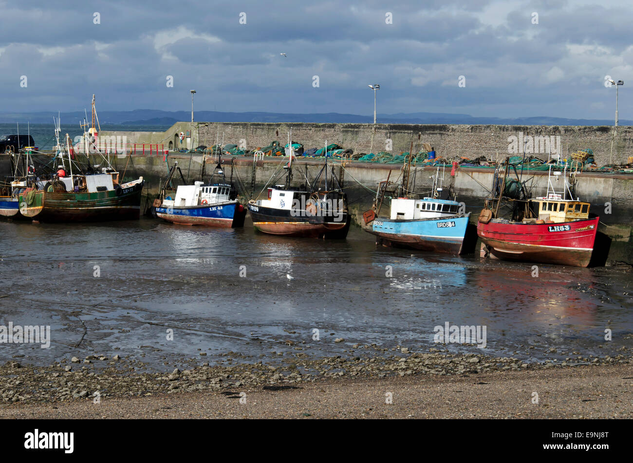 Fishing boats in Port Seton Harbour, near Edinburgh, Scotland, with the tide out Stock Photo Alamy
