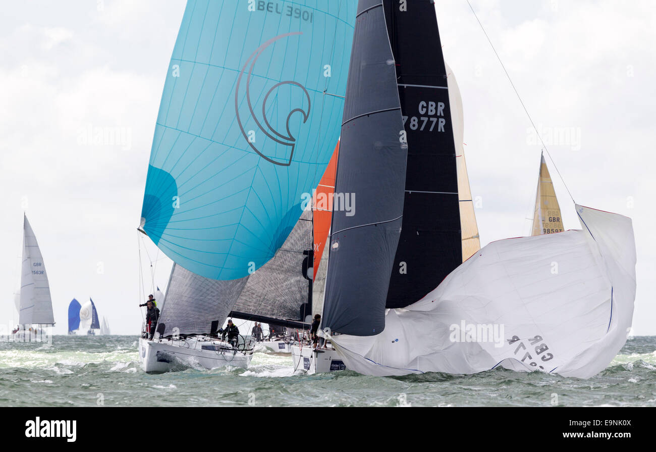 Tilt, racing in IRC class 2 (GBR7877R) leads the Belgian yacht, Alegria, on the opening day of Aberdeen Asset Management Cowes W Stock Photo