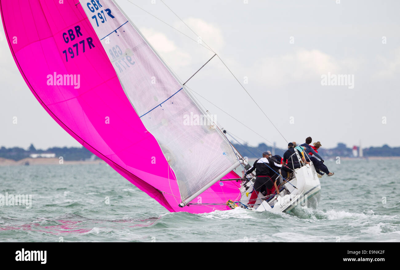 Jet struggles with her spinnaker during racing at  Aberdeen Asset Management Cowes Week. The event began in in 1826 and plays a  Stock Photo