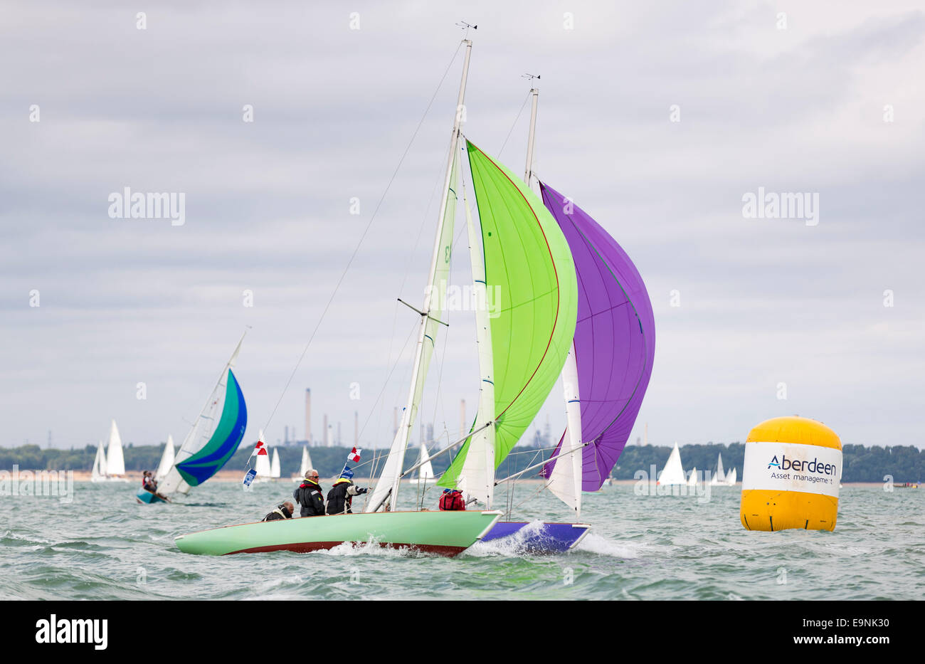 Seaview Mermaids with full spinnakers during racing at  Aberdeen Asset Management Cowes Week. The event began in in 1826 and pla Stock Photo