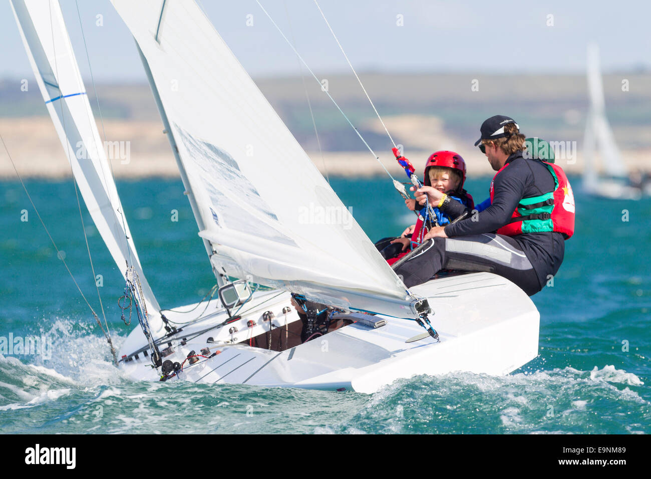 Freddie Simpson 4, and Iain Percy aboard their Star class keel-boat for the Bart's Bash sailing regatta Stock Photo
