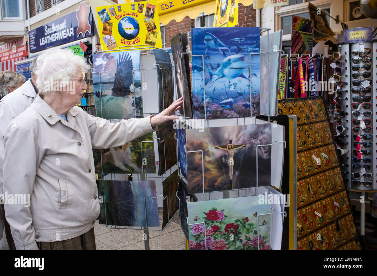 Female senior citizen viewing 3D images at holiday souvenir shop