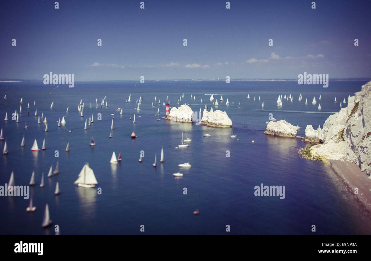 Yachts pass the Needles heading for St Catherine's Point during the 2014 JP Morgan Asset Management Round the Island Race. Stock Photo