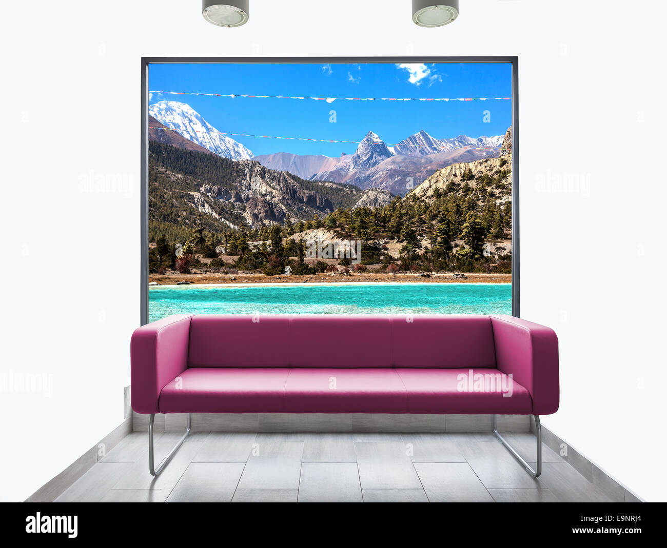 Empty room with sofa and mountain landscape view through window. Stock Photo