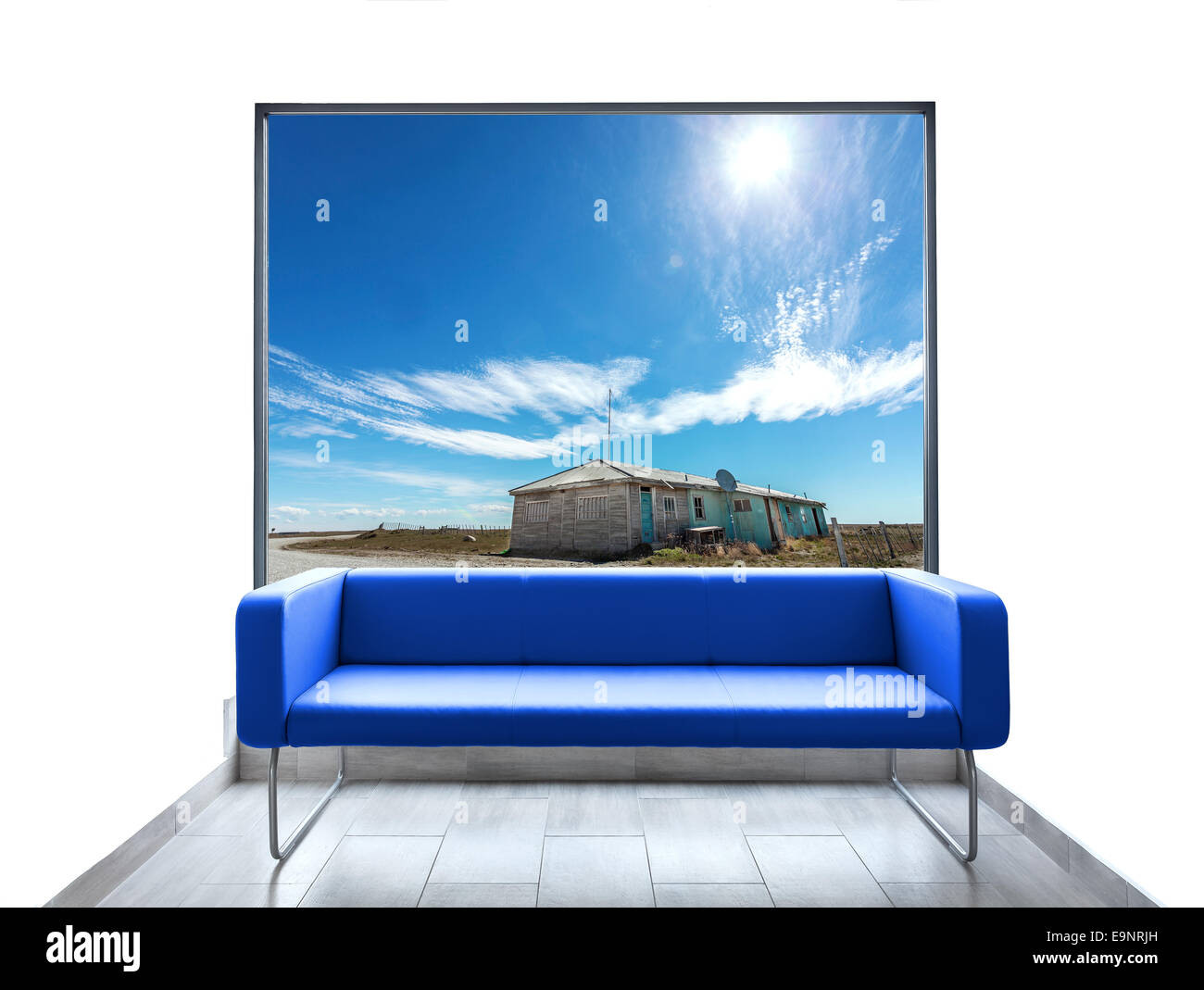Empty room with blue sofa and beautiful view through window. Stock Photo