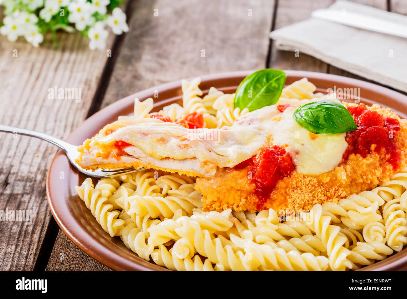 chicken schnitzel with tomato sauce and mozzarella parmesan Stock Photo