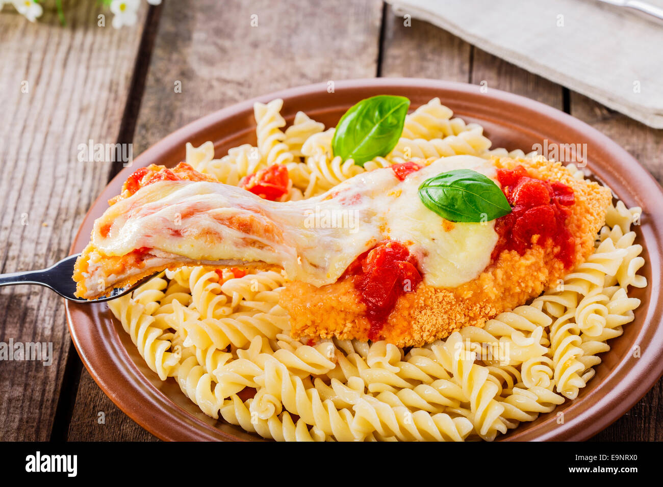chicken schnitzel with tomato sauce and mozzarella parmesan Stock Photo