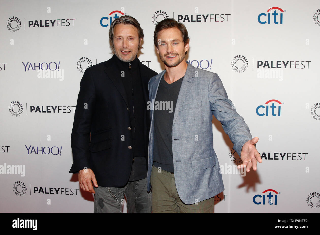 Mads Mikkelsen (L) and Hugh Dancy attend PaleyFest NY 2014 for 'Hannibal' at The Paley Center for Media on October 18, 2014. Stock Photo