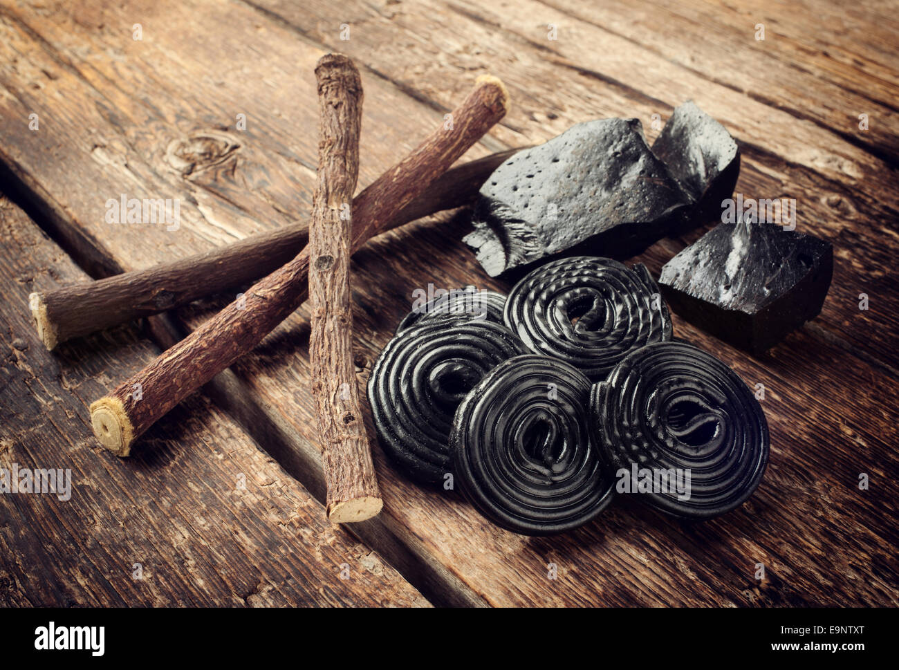 Production steps of licorice, roots, pure blocks and candy on wooden