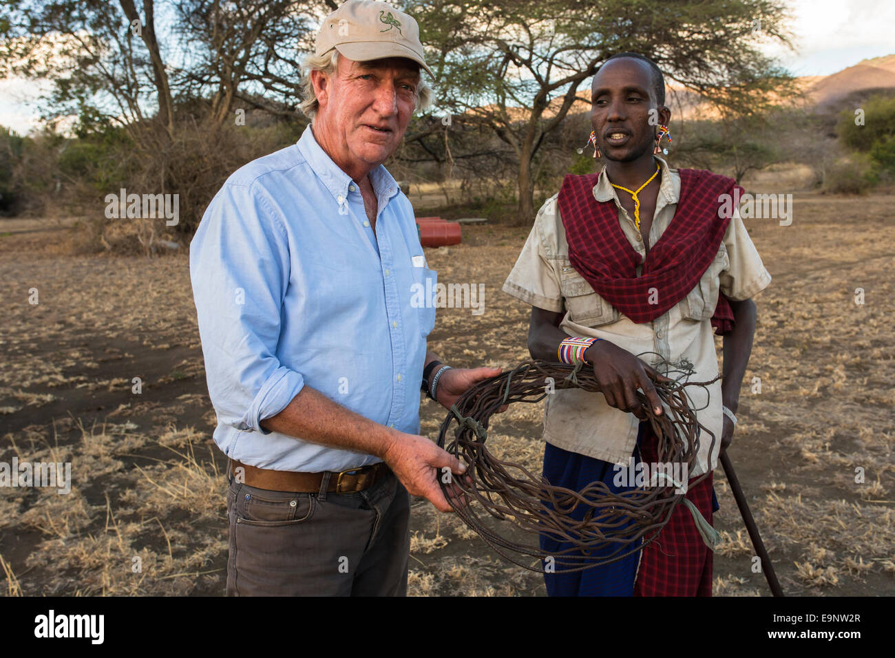 Richard Bonham with Maasai and poaching snares, Mbirikani Group Ranch, Amboseli-Tsavo eco-system, Kenya, Africa, October 2012 Stock Photo
