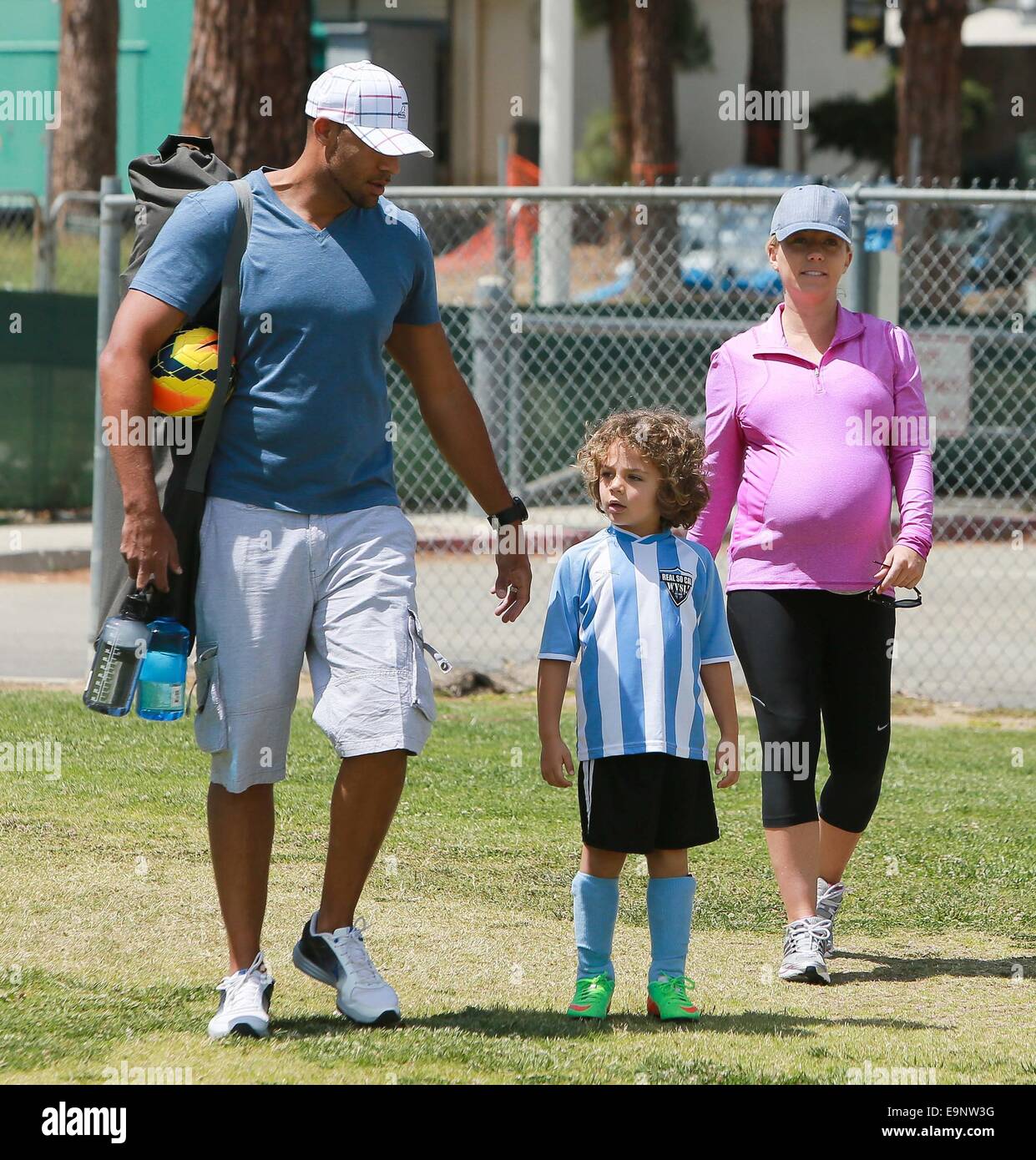 A heavily pregnant Kendra Wilkinson and husband Hank Baskett take their  son, Hank Baskett IV to his football game Featuring: Kendra Wilkinson,Hank  Baskett,Hank Baskett IV Where: Los Angeles, California, United States When: