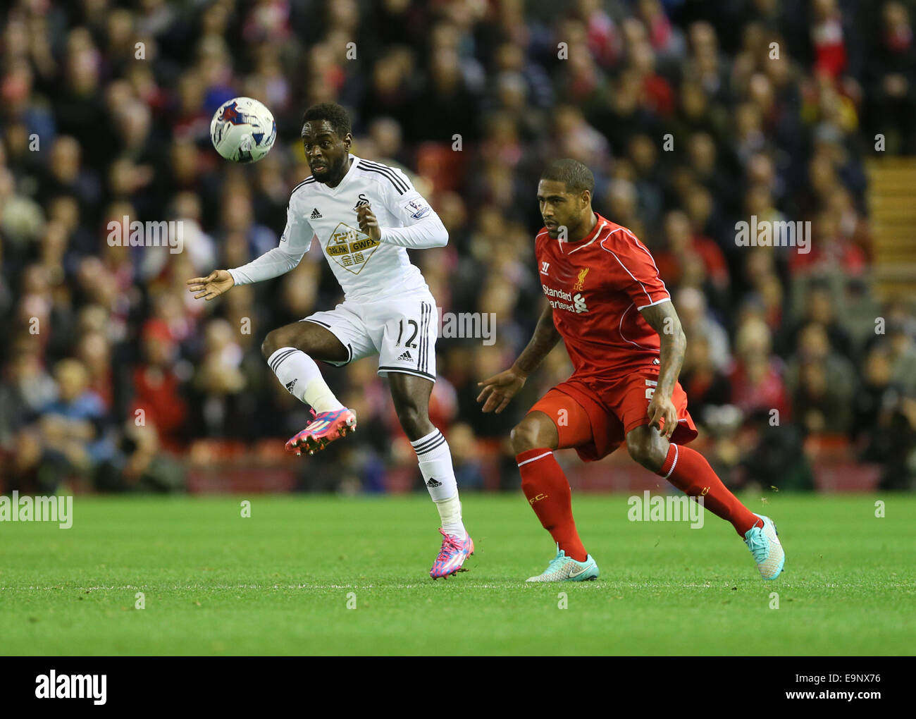 London, UK. 28th Oct, 2014. Liverpool's Glen Johnson tussles with Swansea's Nathan Dyer.League Cup Fourth Round- Liverpool vs Swansea City - Anfield - England - 28th October 2014 - Picture David Klein/Sportimage. © csm/Alamy Live News Stock Photo