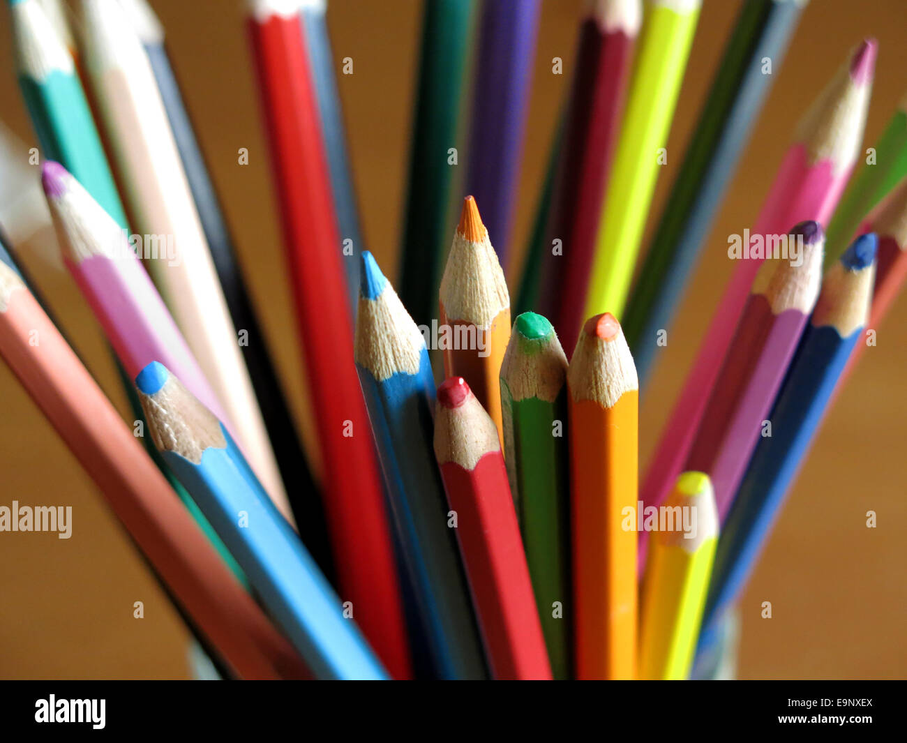 Colored pencils on a desk Stock Photo - Alamy