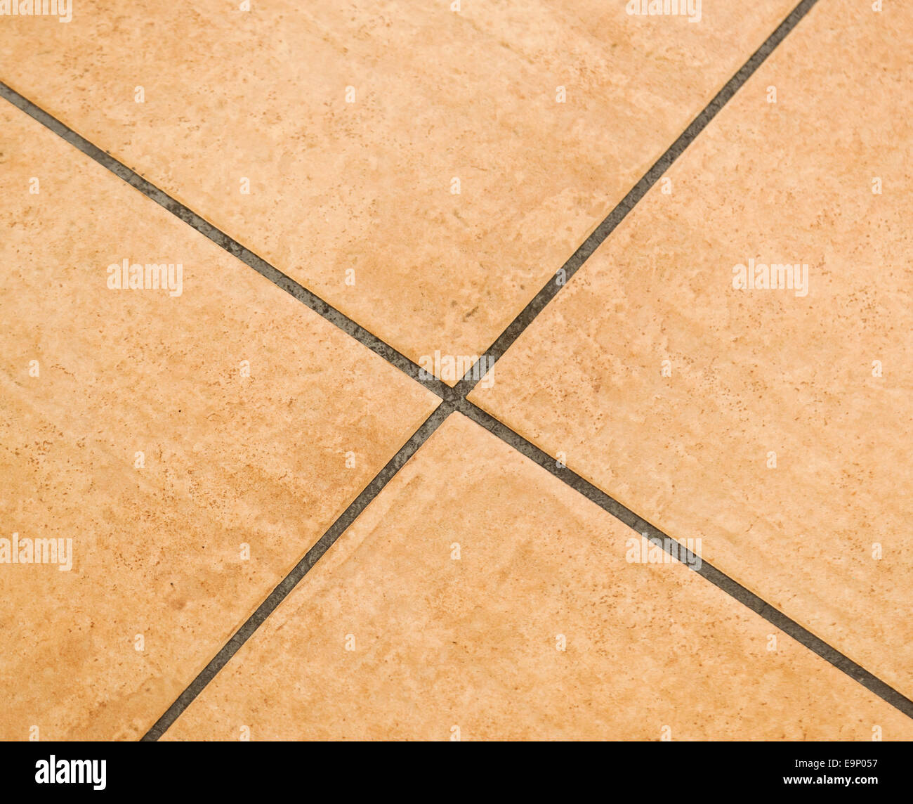 Brown ceramic floor tiles close up texture. Stock Photo
