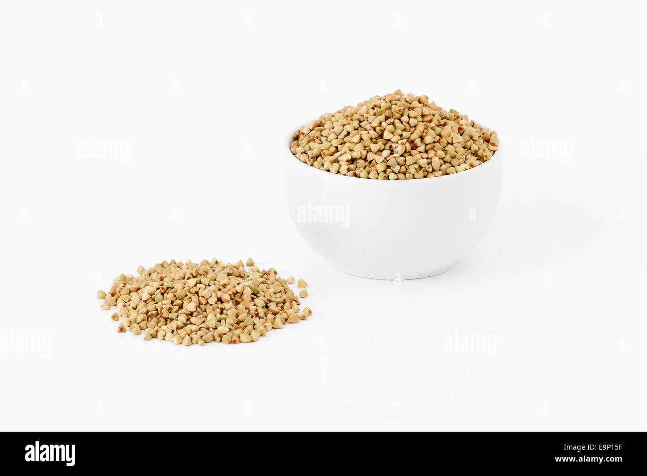 Buckwheat grains in a bowl on white background Stock Photo Alamy