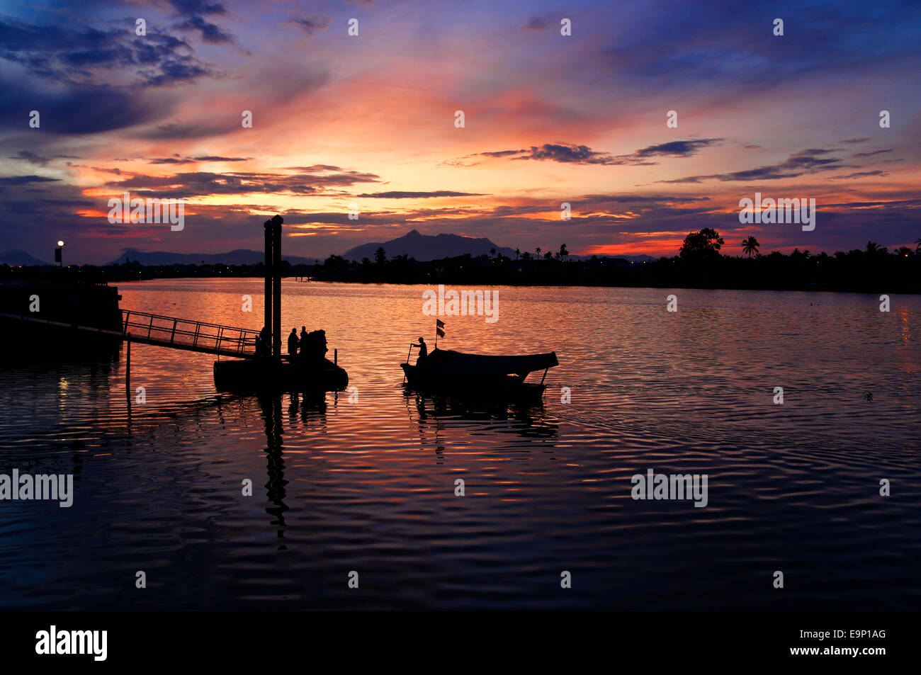 Sunset over the Sarawak River at Kuching, Malaysia Stock Photo