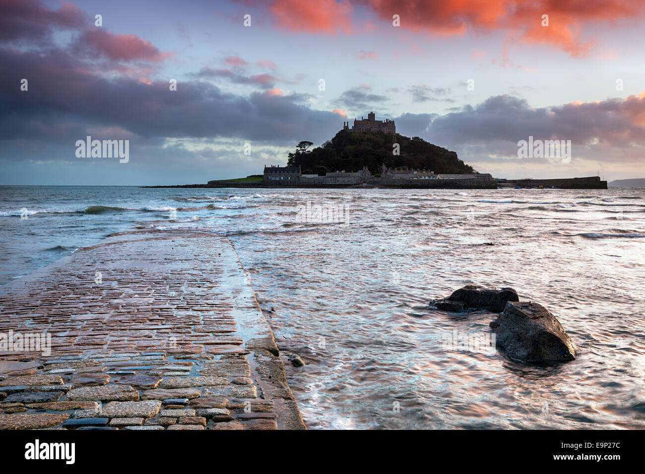 Sunset at the causeway at high tide leading to St Michaels Mount at Marazion near Penzance in Cornwall Stock Photo
