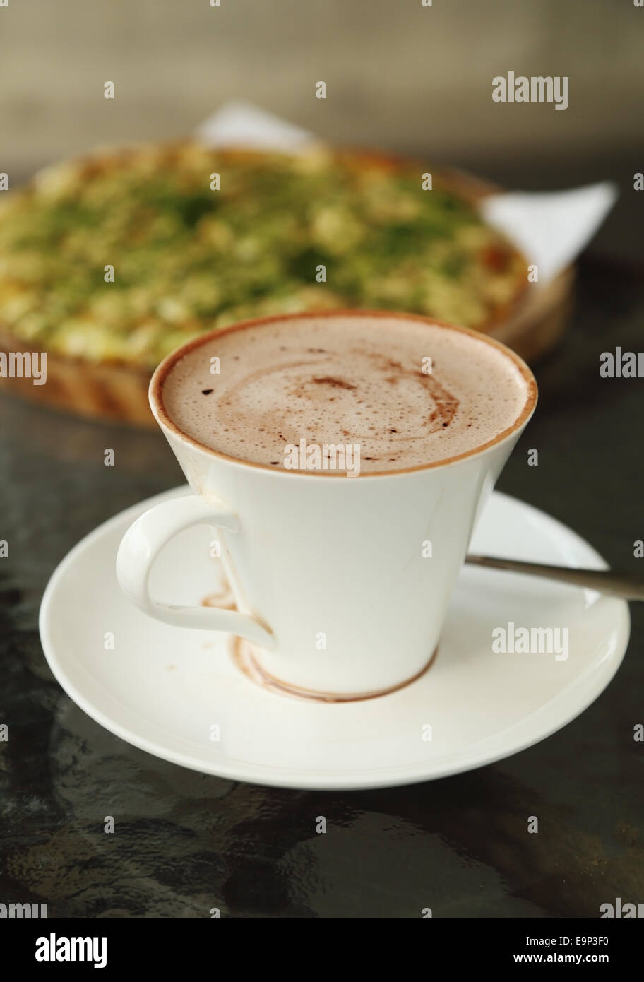 cup of hot chocolate with Pizza Japanese style in a cafe Stock Photo