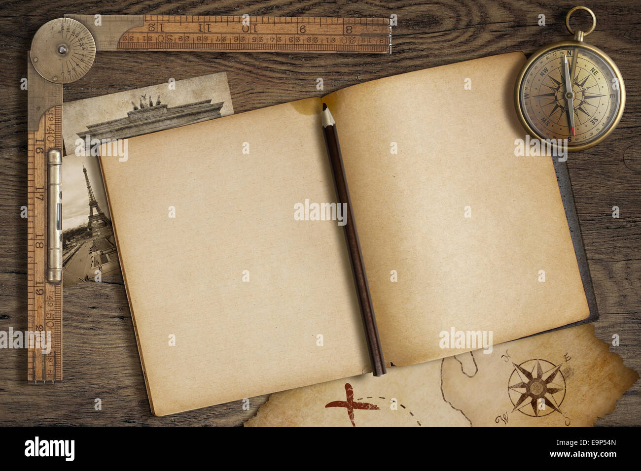 Open blank diary with map, pencil and compass. Adventure and travel nautical theme. Stock Photo