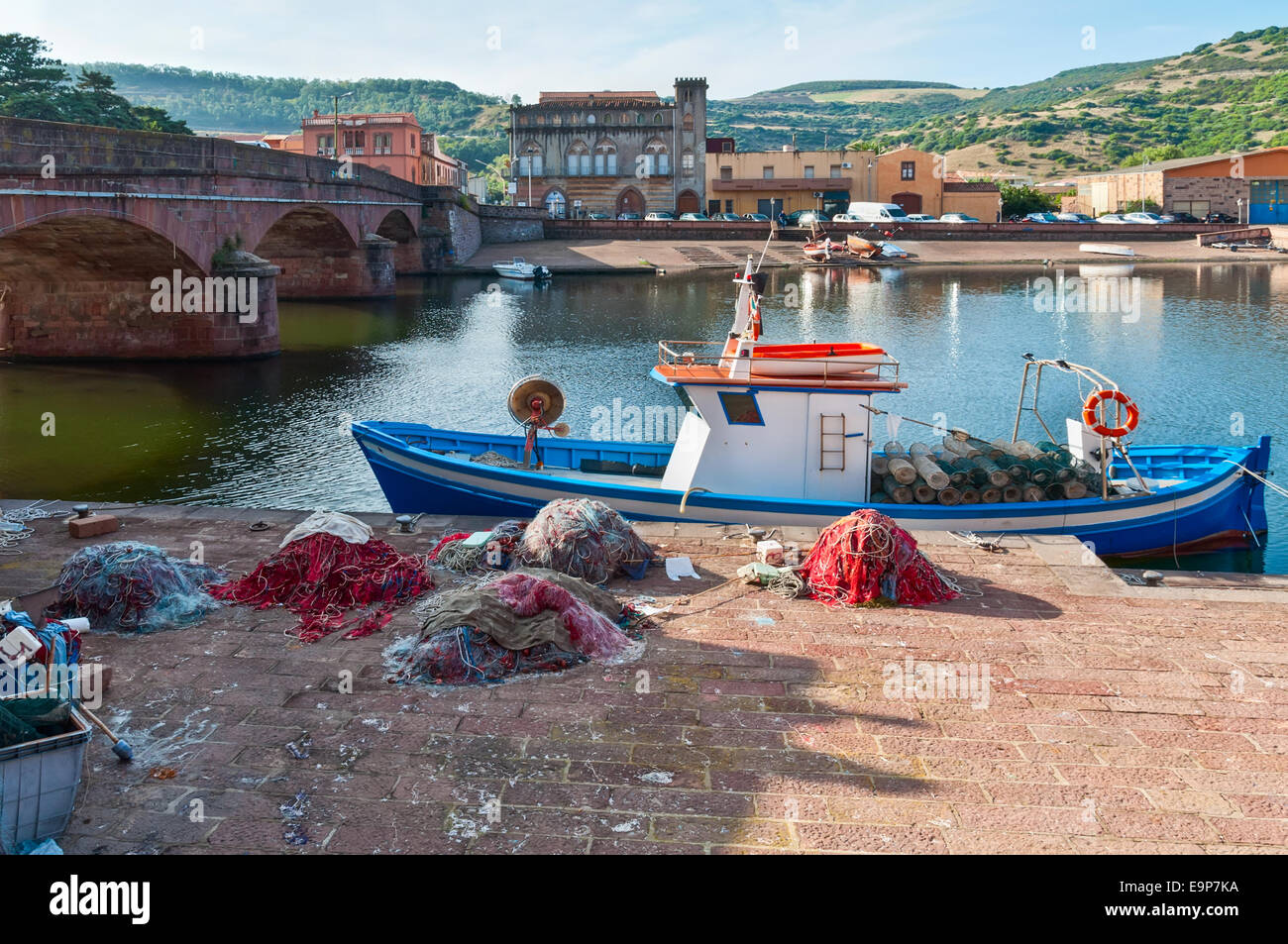 Fishing boat and nets on the river in Bosa in Sardinia Stock Photo