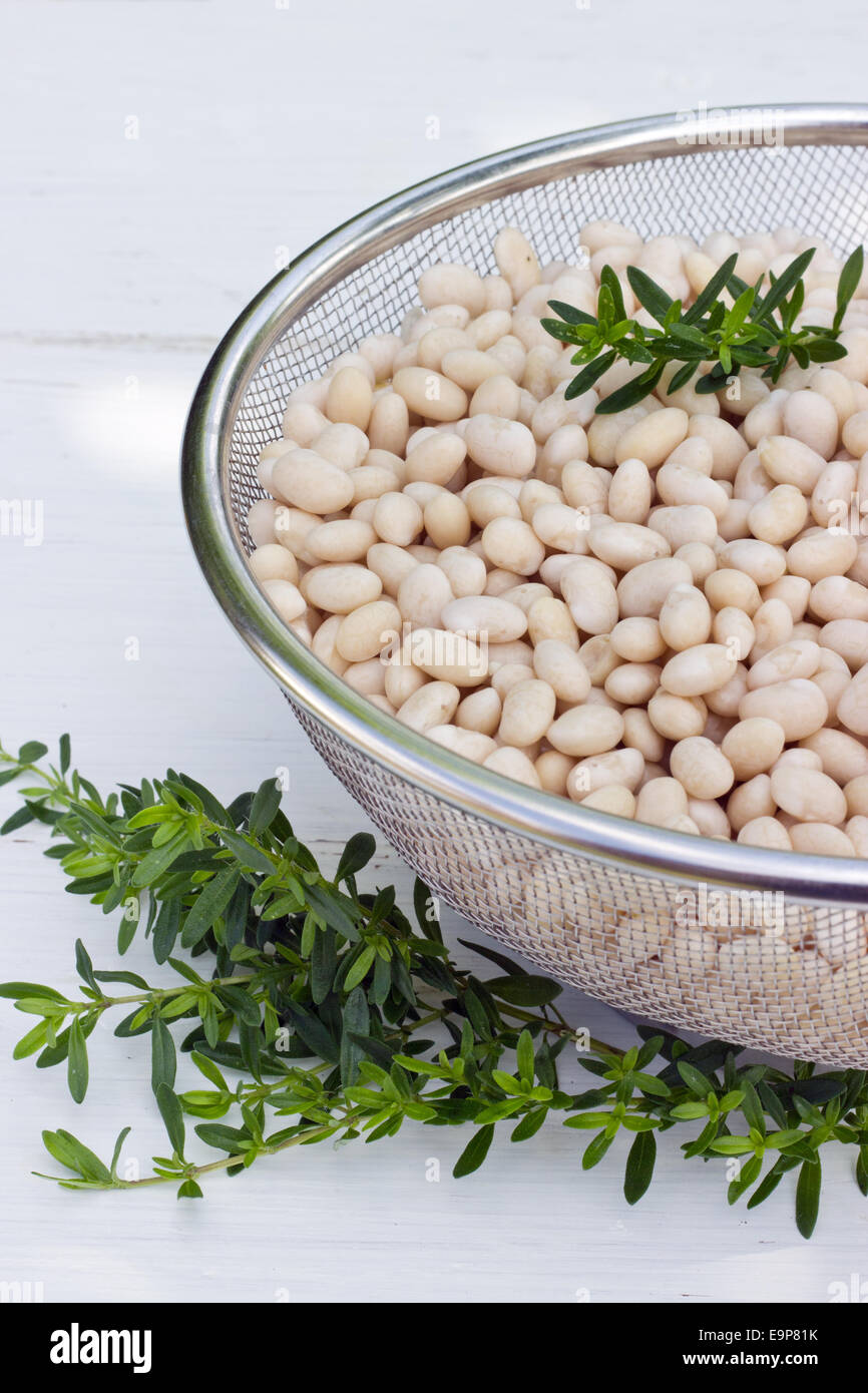 sieve with white beans Stock Photo Alamy