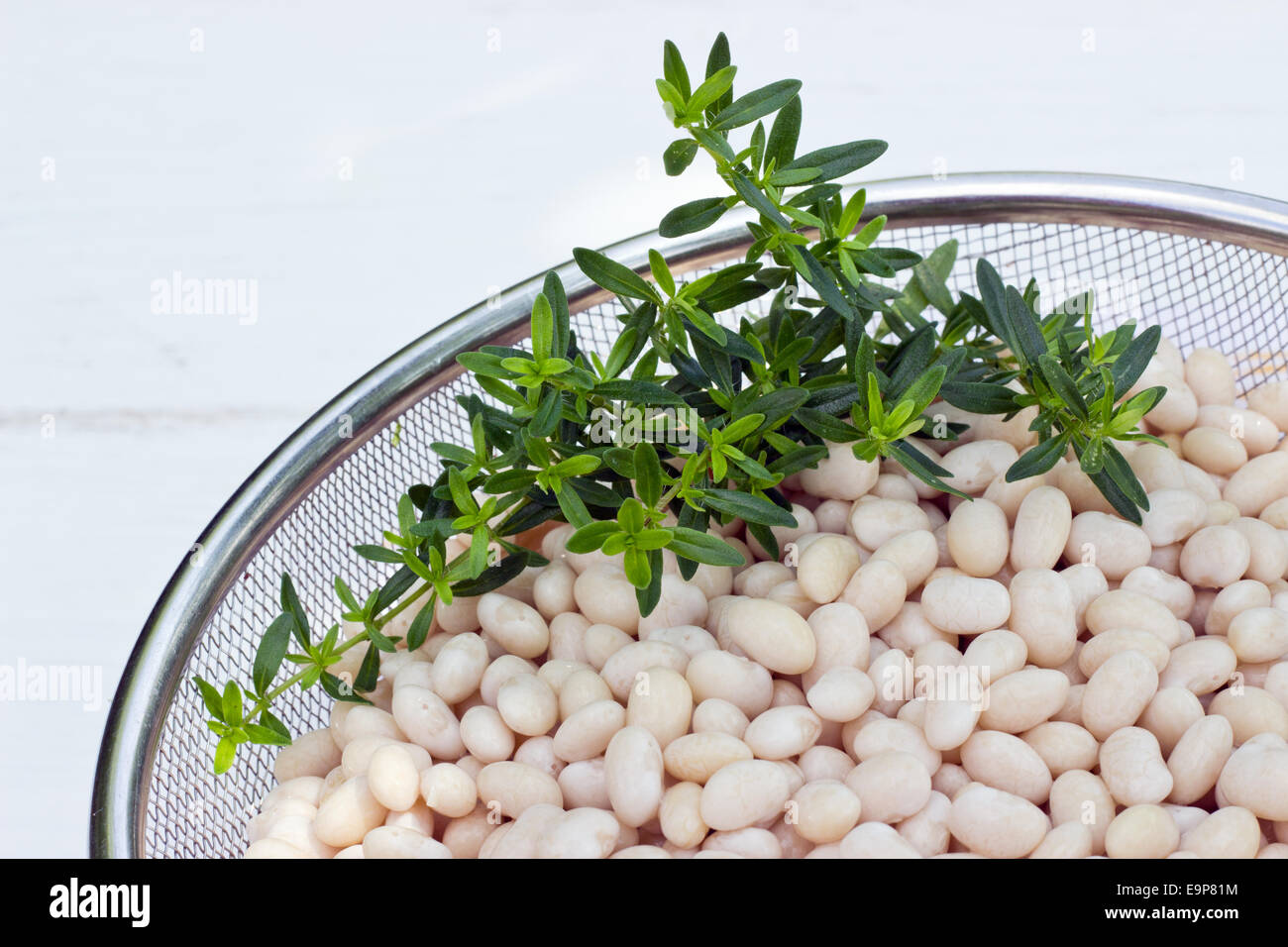 sieve with white beans Stock Photo Alamy