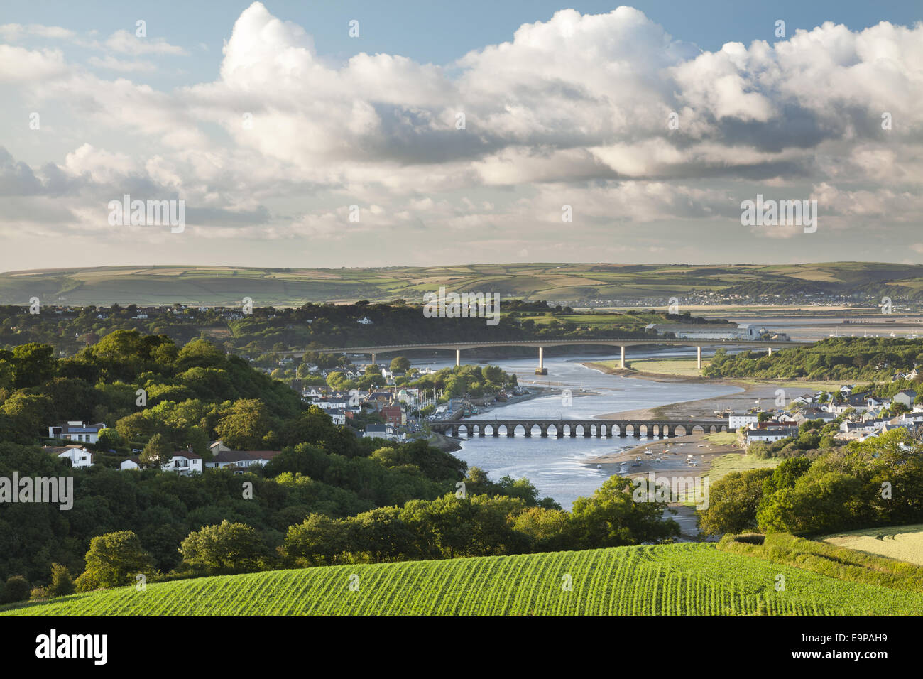 View of River Torridge winding through Bideford and under Bideford Old Bridge and then Torridge Bridge before merging with River Taw at Instow, viewed from hills above town on sunny summer evening, Bideford, North Devon, England, July Stock Photo