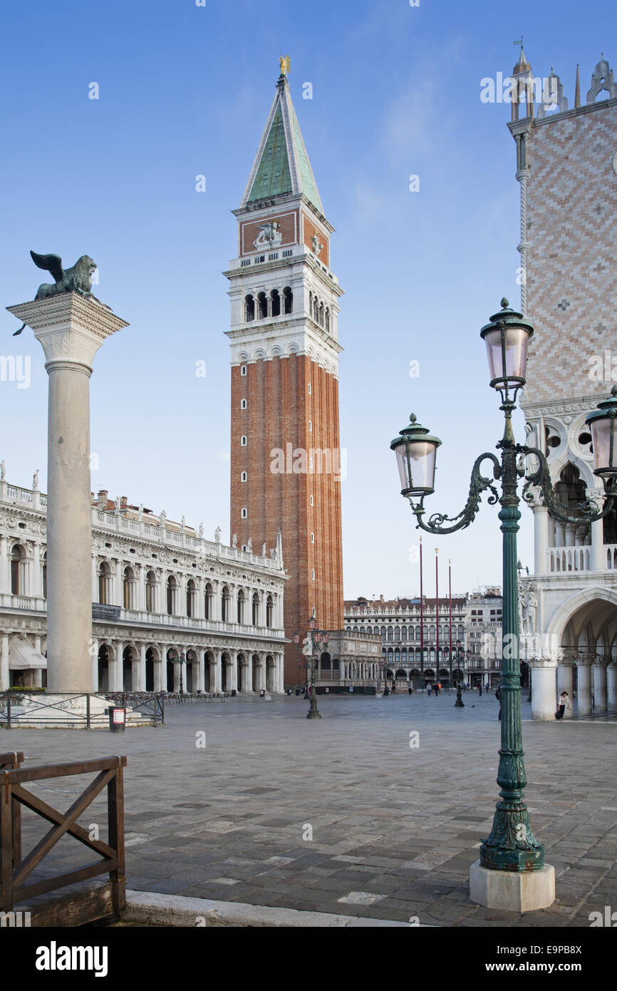 View of city square with Lion of Saint Mark on column and belltower of Roman Catholic cathedral, Leone Di San Marco, St Mark's Campanile, St. Mark's Basilica, Piazzetta San Marco, San Marco District, Venice, Veneto, Italy, May Stock Photo