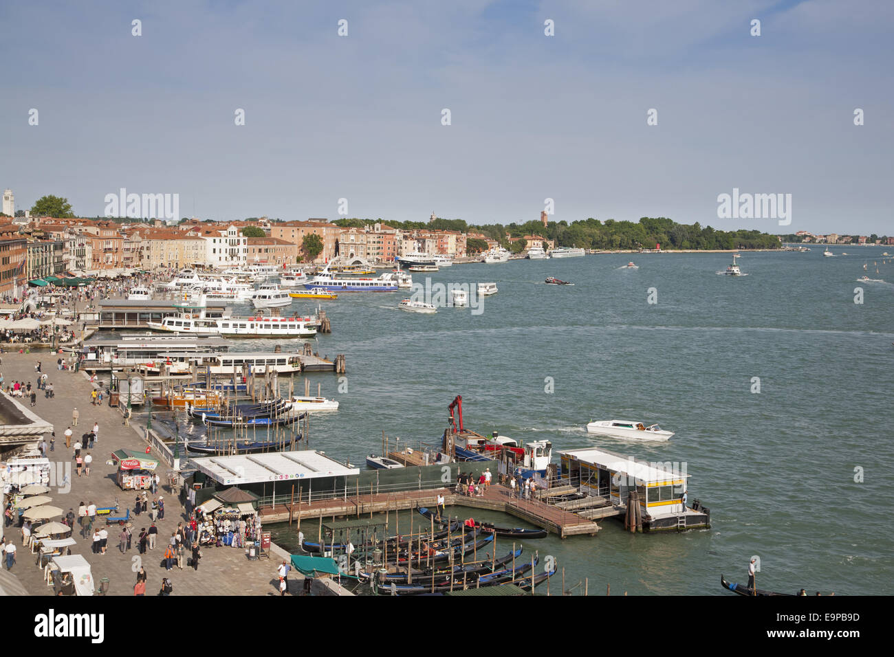 View of waterfront with gondolas and tour boats, looking from roof of Hotel Danielli, Riva Degli Schiavoni, Castello District, Venice, Veneto, Italy, May Stock Photo