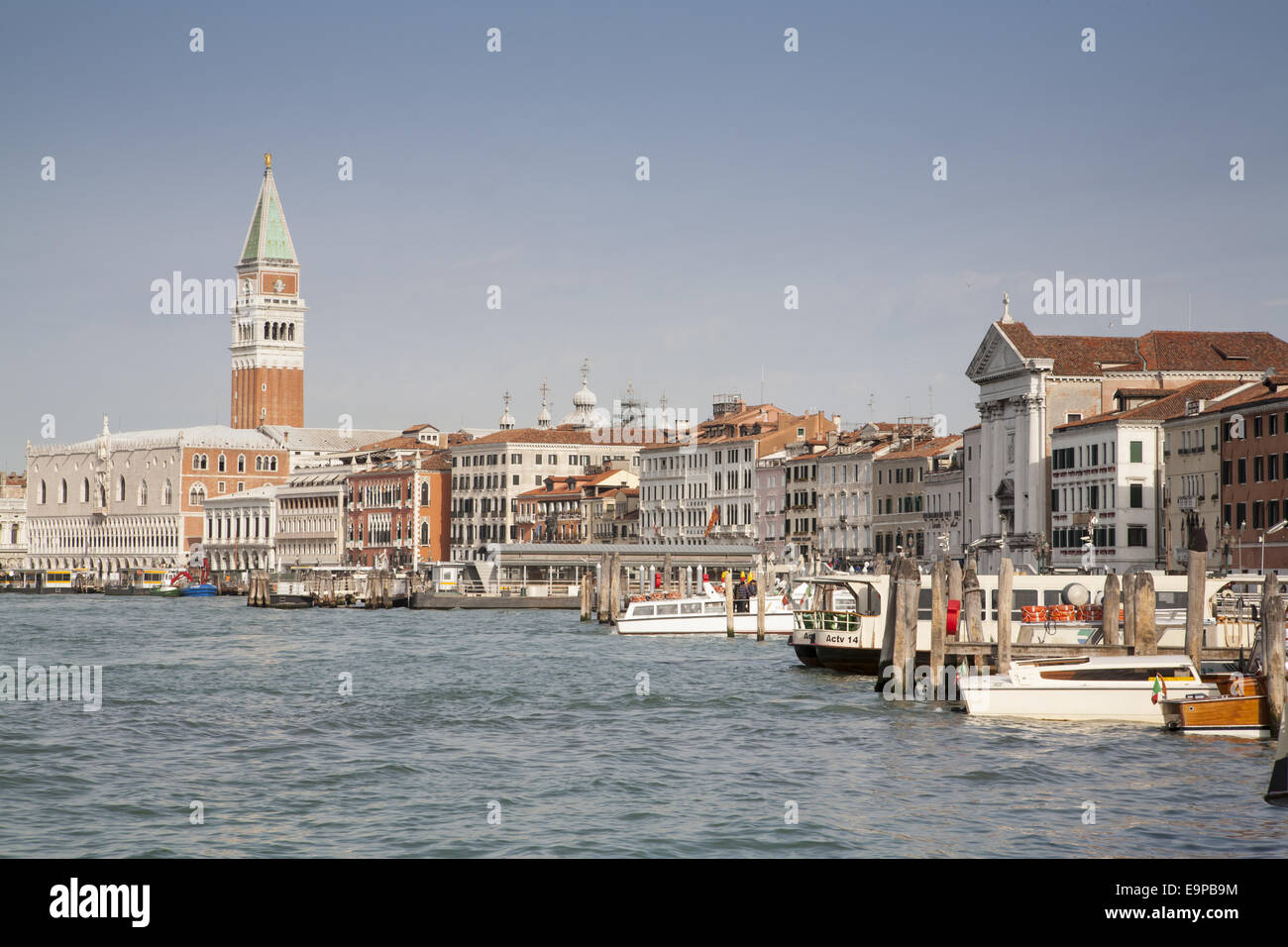 View across waterfront towards palace and cathedral belltower, looking from Arsenale Vaporetto stop, Doge's Palace, St. Mark's Campanile, St. Mark's Basilica, Piazza San Marco, San Marco District, Venice, Veneto, Italy, May Stock Photo