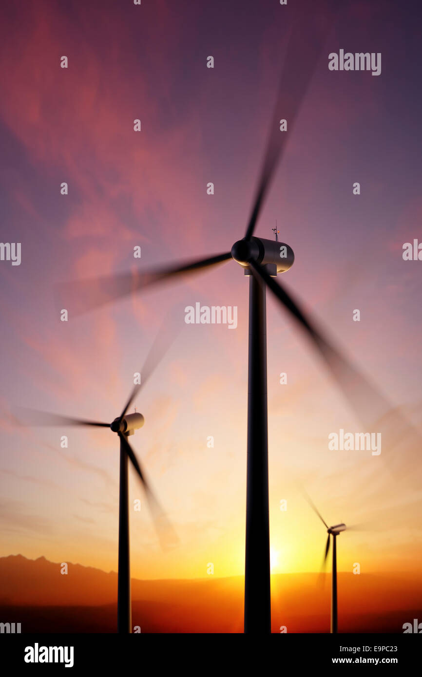 Wind Turbine blades spinning at close range with golden sunset. Focused on tip of front propeller - 3D artwork Stock Photo