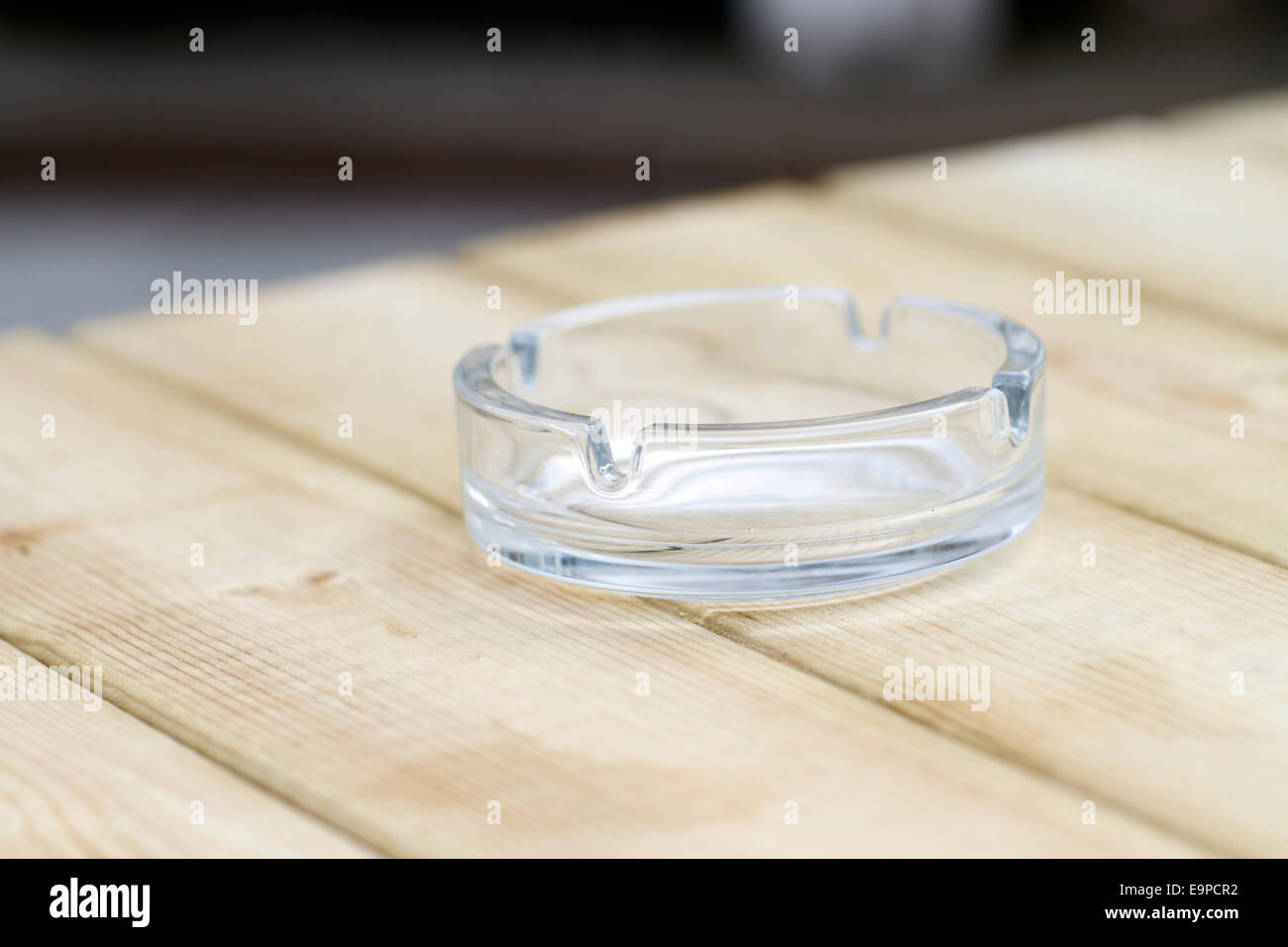 Ashtray on a wooden table Stock Photo