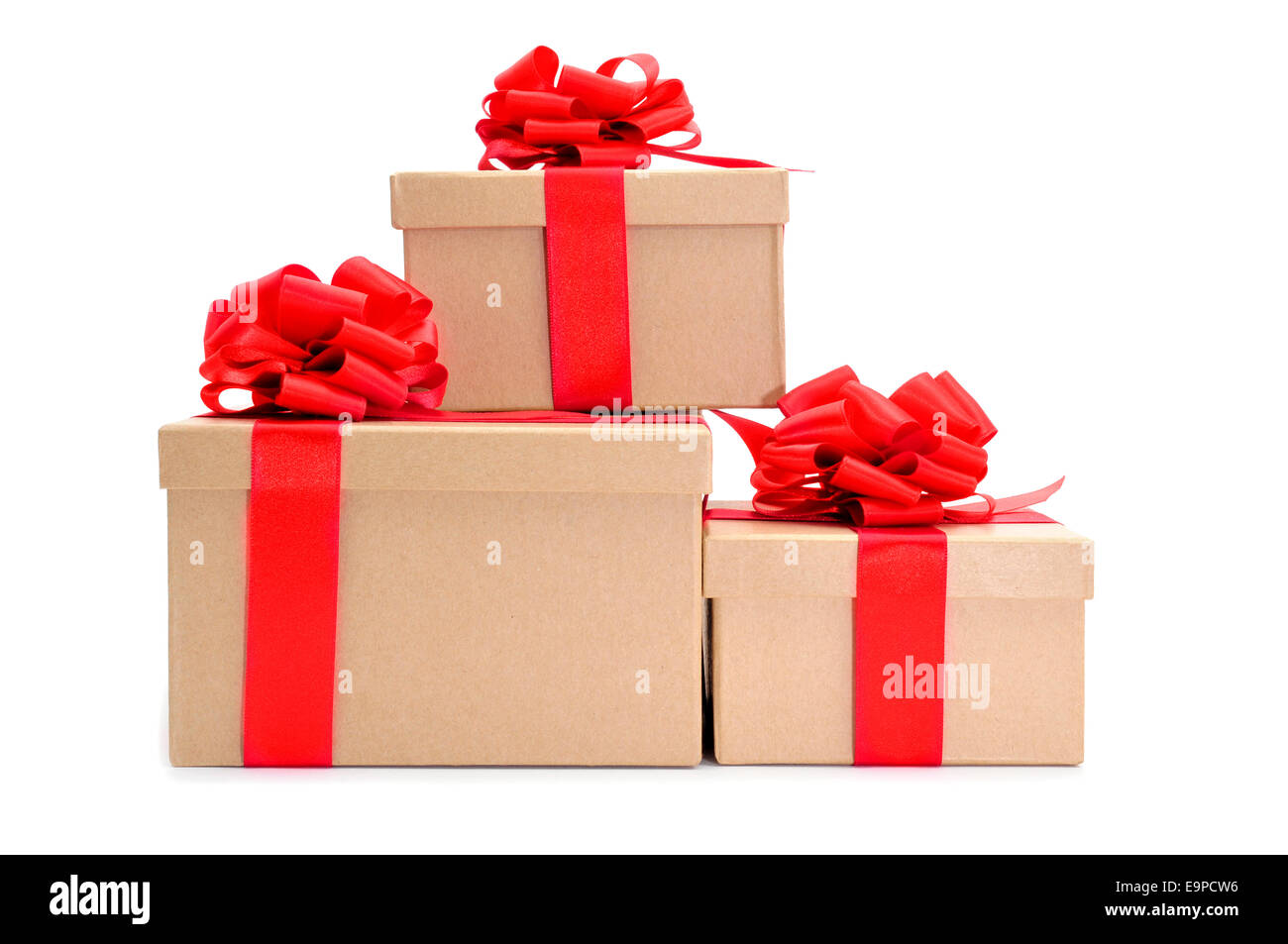 some cardboard gifts boxes with red ribbon bows on a white background ...