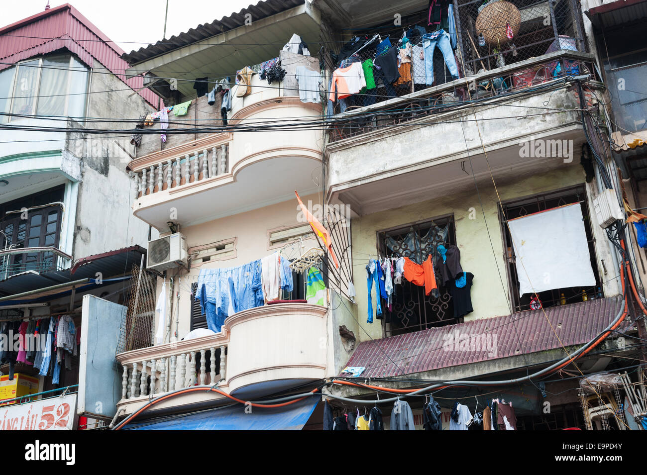 Hanoi housing - laundry drying on the balconies of an apartment building in Vietnam Stock Photo