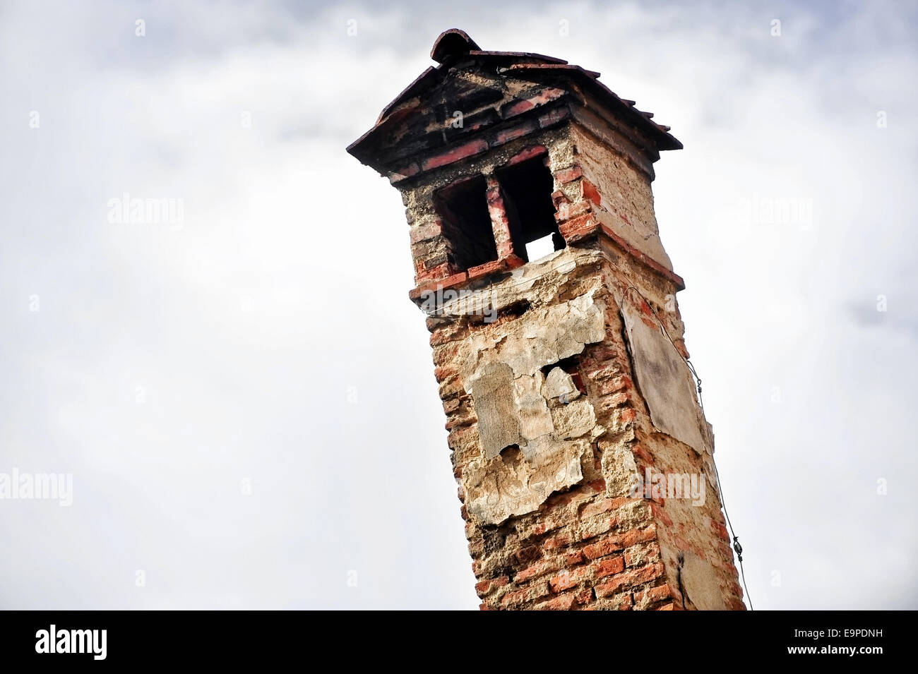 Architecture detail with very old brick smoking chimney Stock Photo