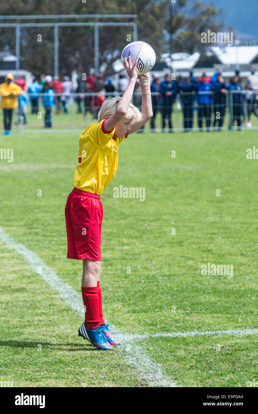 Junior football player making a throw-in, Cape Town, South Africa Stock Photo