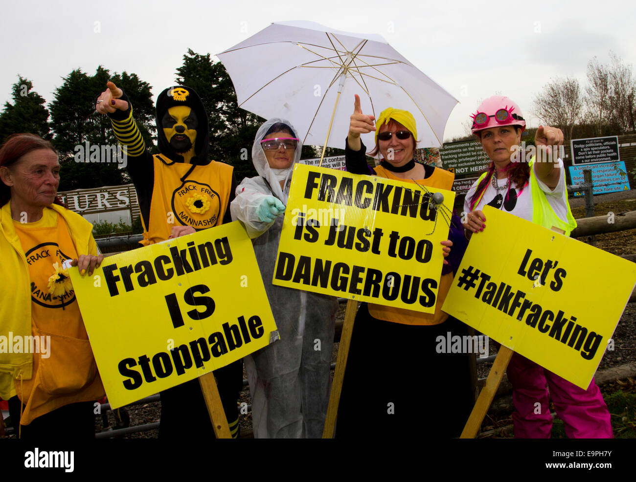 Westby Nr Blackpool, Lancashire 31st October, 2014. Frack Free Lancashire Local Residents opposed to proposed fracking demonstrate in Fancy Dress outside Maple Farm Nursery. The area is filled with Anti-Fracking Signs erected & paid for by local businessman Mr John Toothill, who on his own admission is obsessive about his objection to proposed fracking at nearby Plumpton. Lancashire County Council is considering Cuadrilla’s planning application and they are encountering strong community resistance. Stock Photo