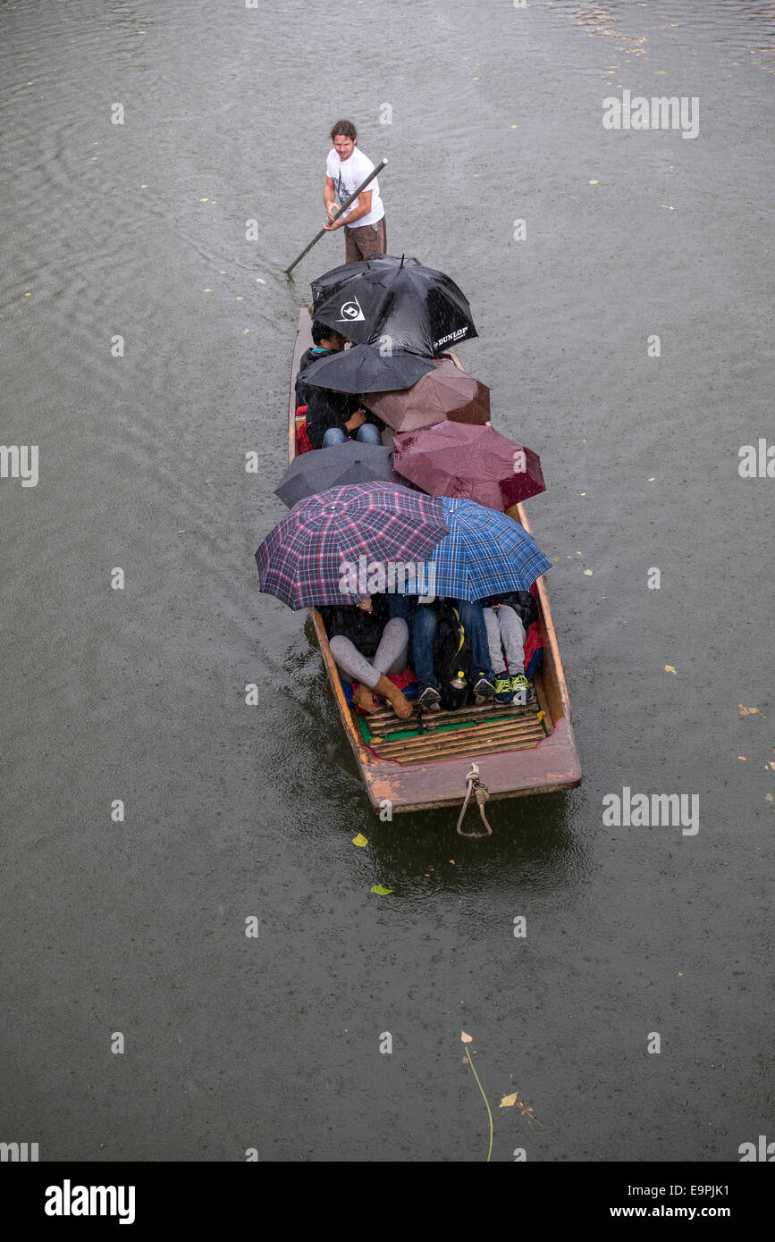 Rain shower whilst punting on the River Cam, Cambridge UK Stock Photo