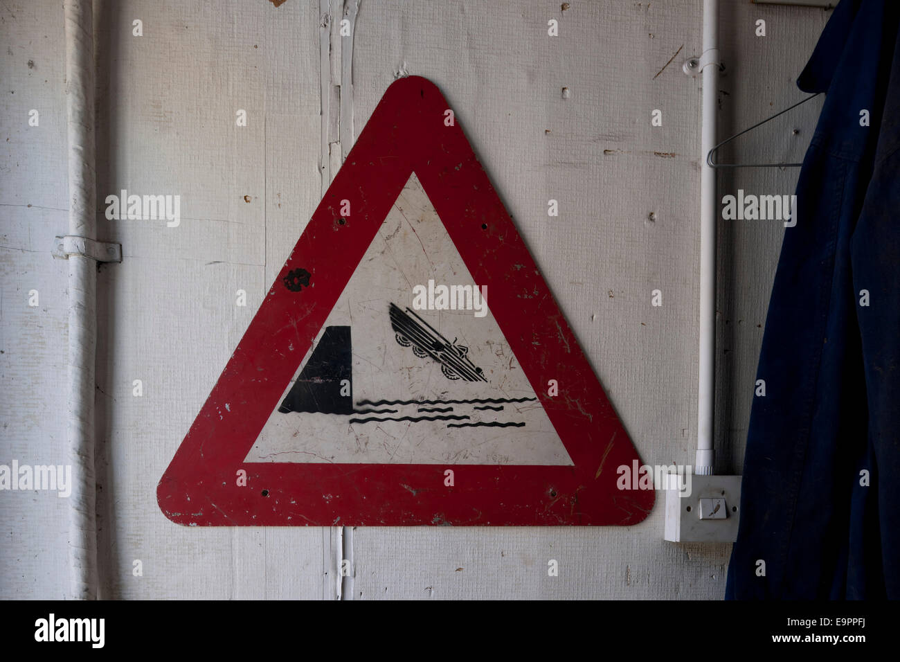 Danger road sign in workshop, Kingston upon Thames, England, UK Stock Photo