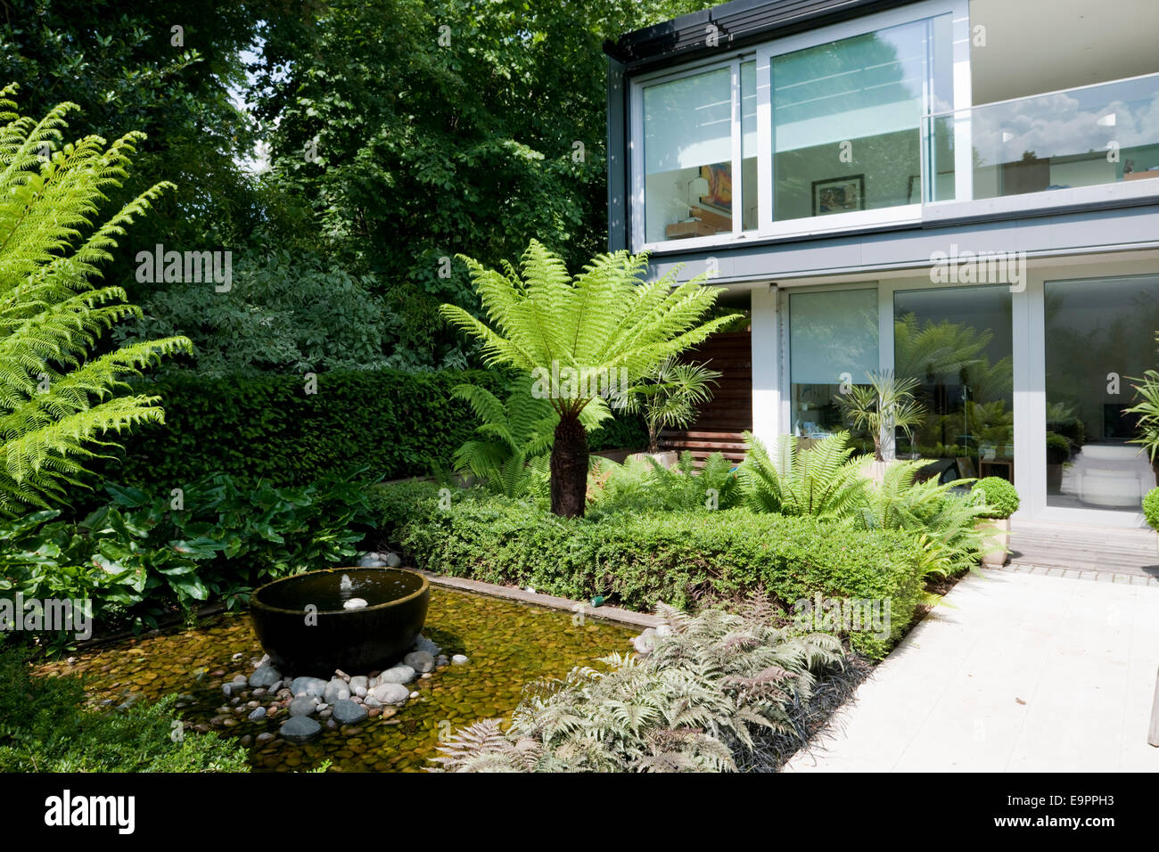 Water feature in garden terrace of the Glass House, River Lane, Petersham, Middlesex, England, UK. Stock Photo