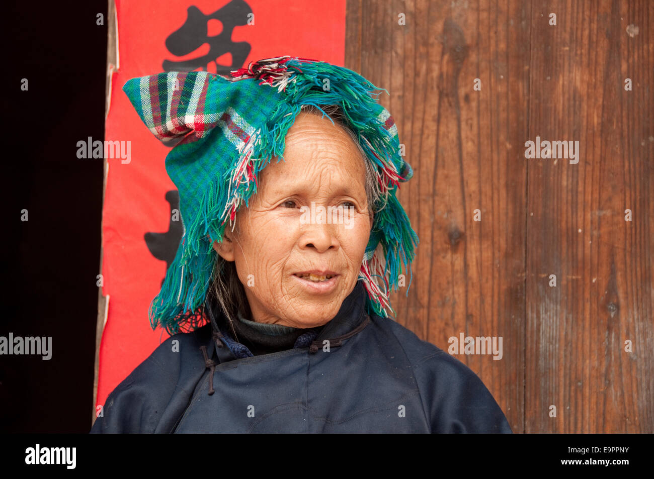 A Buyi (Buyei) old woman with traditional headdress, Buyi village ...