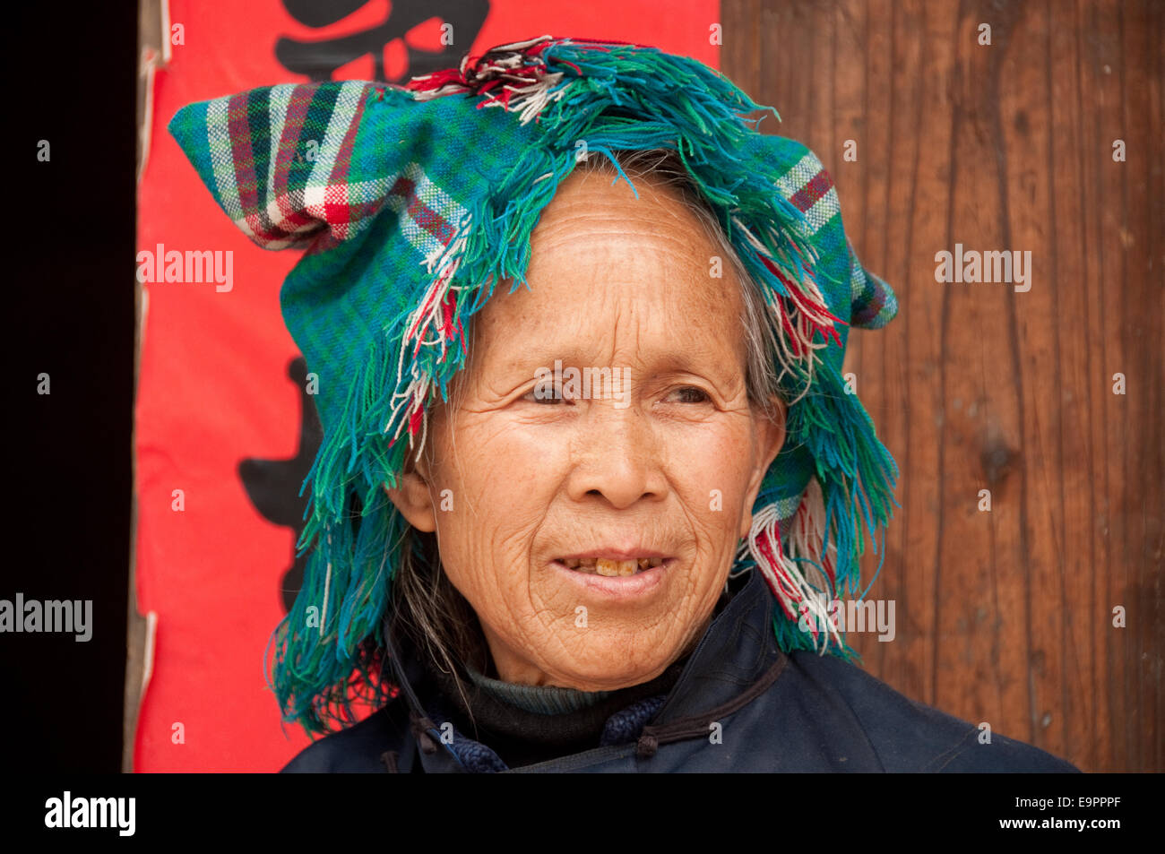 A Buyi (Buyei) old woman with traditional headdress, Buyi village ...