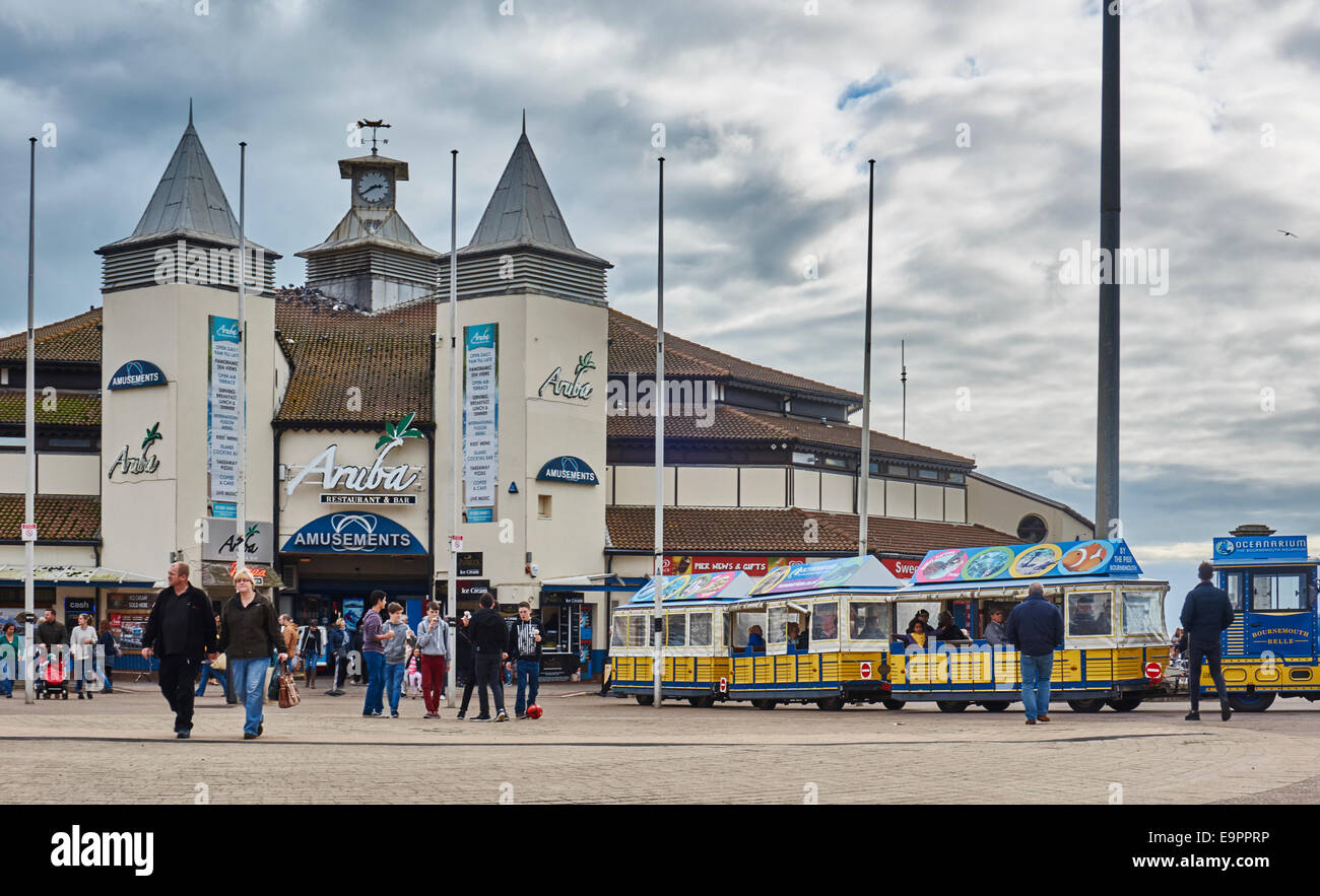 Bournemouth Pier Family Amusements on an overcast day, with many visitors and the 'Bournemouth Belle' train. Dorset, England, UK. Stock Photo