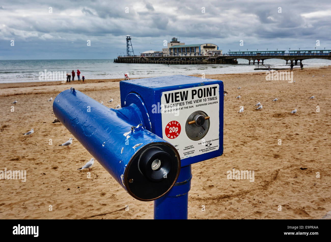 View Point telescope with Bournemouth pier, beach and people in the ...