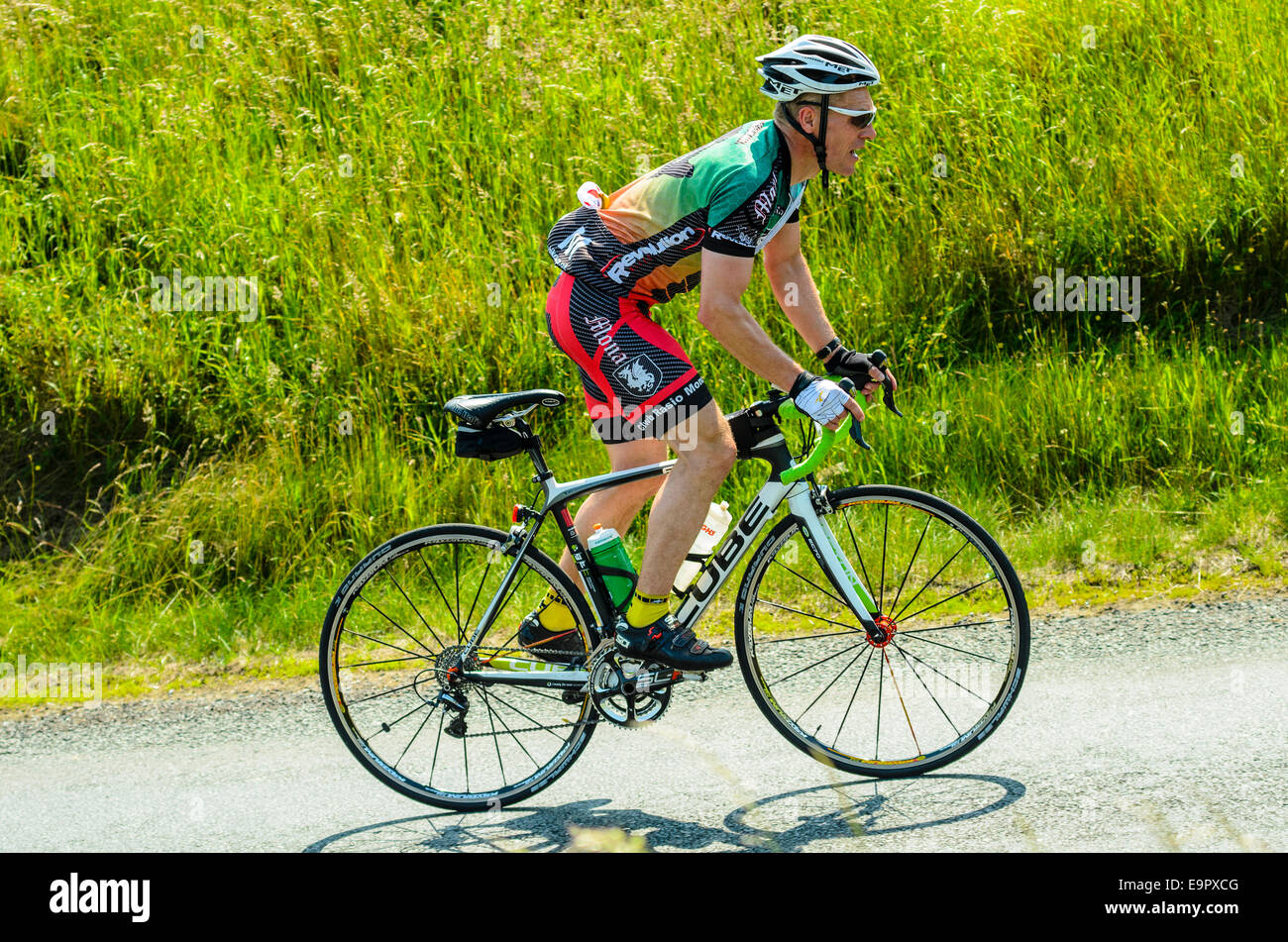 Cyclist tackling the Nick of Pendle climb during sportive event in the Forest of Bowland Lancashire Stock Photo